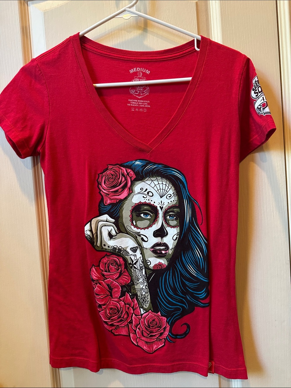 Women’s Red V-Neck Graphic Tee with Skull Portrait